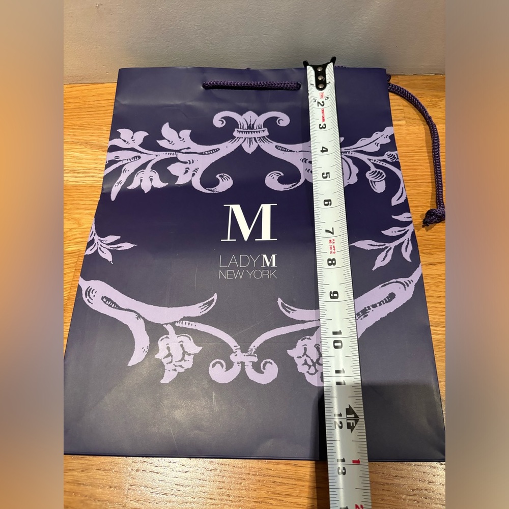New Lady M purple shopping bag.